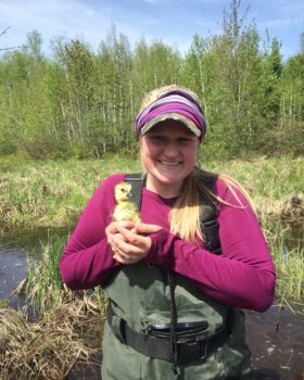 Amber holding ducklings