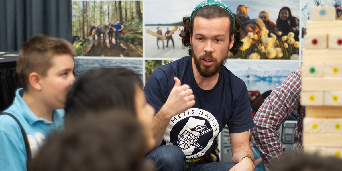 The author engaging youth at the Métis Futures Career Fair in Edmonton. 