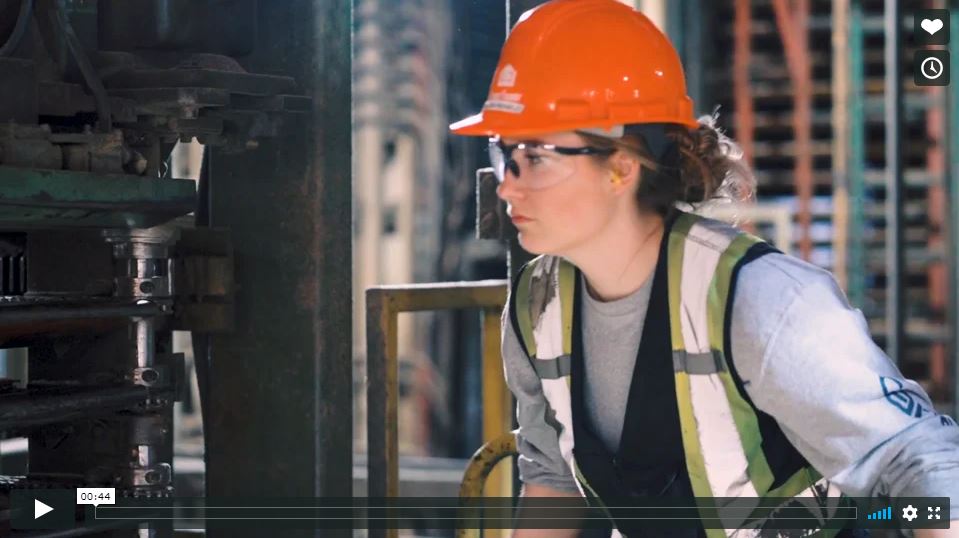 A women wearing head and eye protection