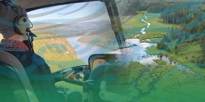 a young man flies in a helicopter