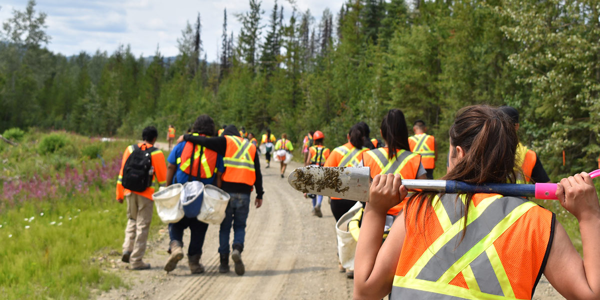 youth walking along the road