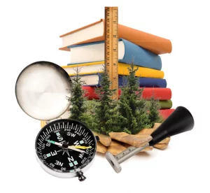 A stack of books, ruler, compass, and other resources