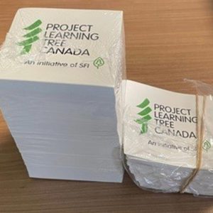 stack of stickers with PLT Canada logo