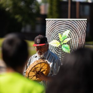 A man beating a drum