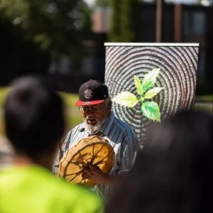 A man beating a drum