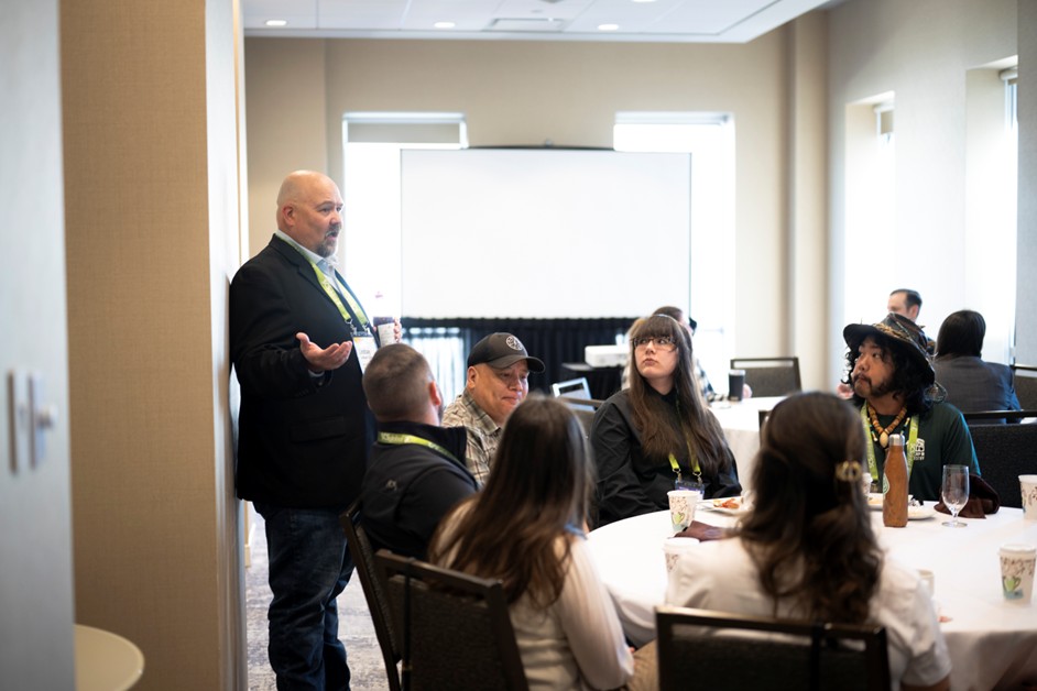 forest leader speaking to indigenous youth delegates